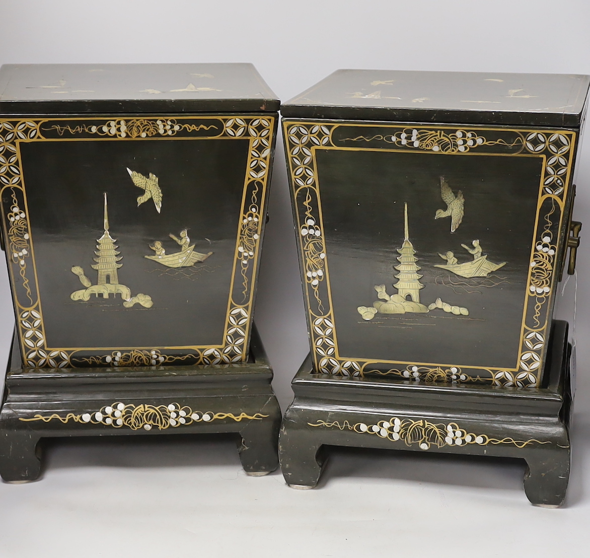 A pair of Chinese lidded lacquer wine coolers and stands, 35cm high